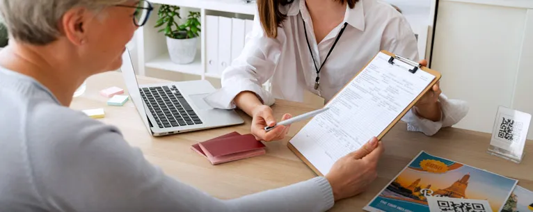 Travel expert reviewing financial documents for a tourist visa application